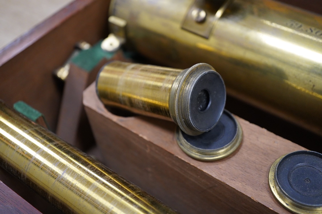 A late 19th century brass single drawer refracting telescope by F.L. West, 39 Southampton Street, Strand, London, in a fitted mahogany case, with folding brass tabletop tripod stand, and a number of alternative lenses, t